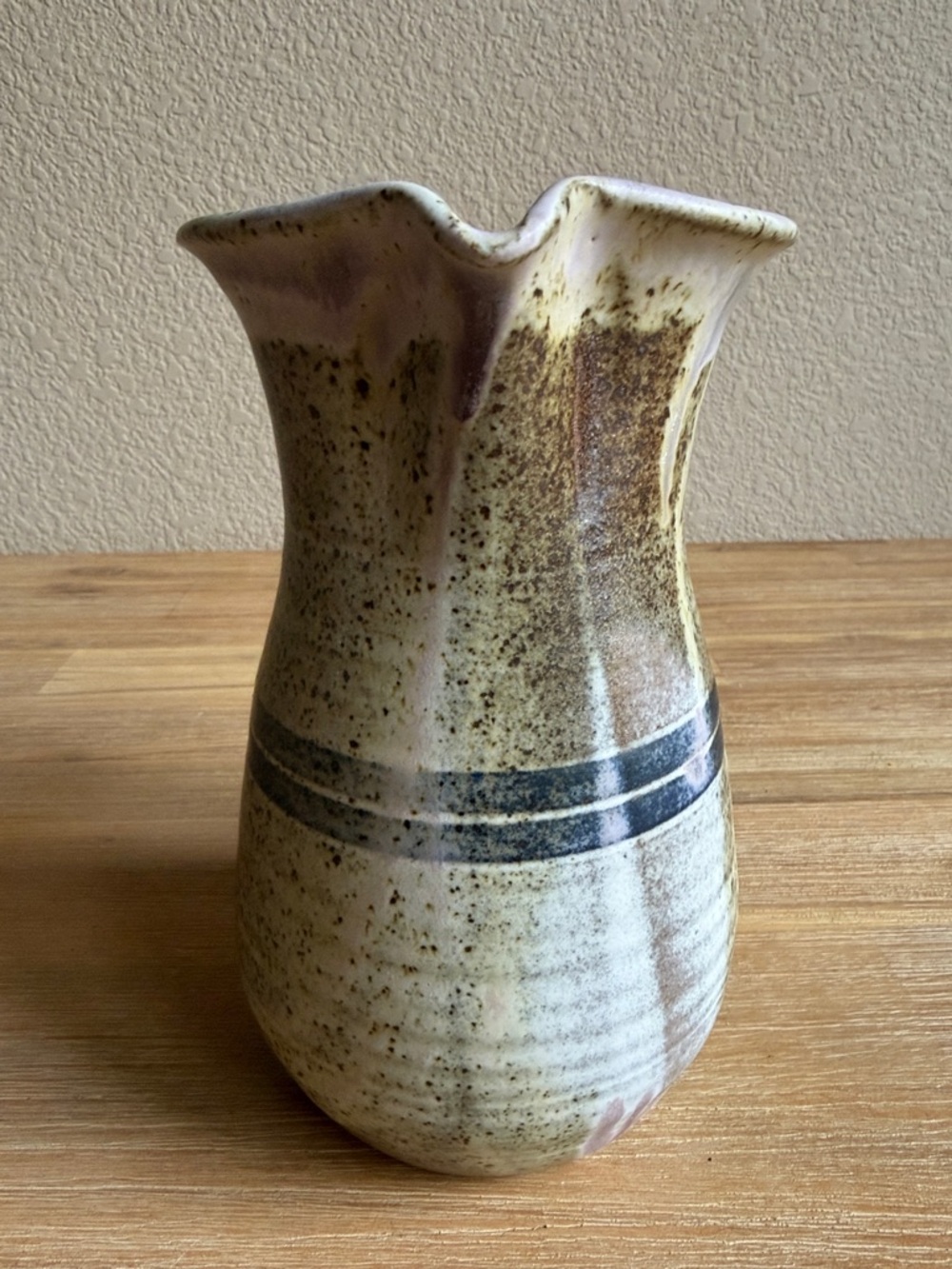 Handcrafted Speckled Ceramic Pitcher in Beige with Blue Stripe - Picture 3 of 13